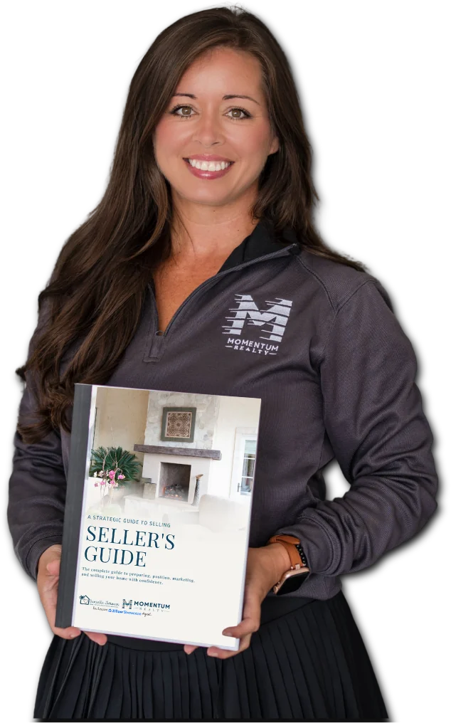 Danielle Jarman holding the Seller's Guide
